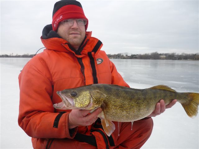 Quinte Jan 1 2011 013.jpg - Amos with a beautiful Walleye from Bay of Quinte.